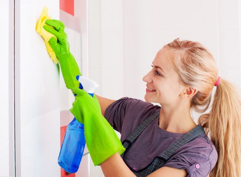 Carpet cleaning professional preparing equipment for a booked service